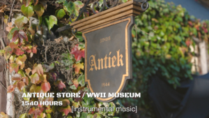 Establishing shot of a sign for an antique store. It reads, "sinds ANTIEK 1944."